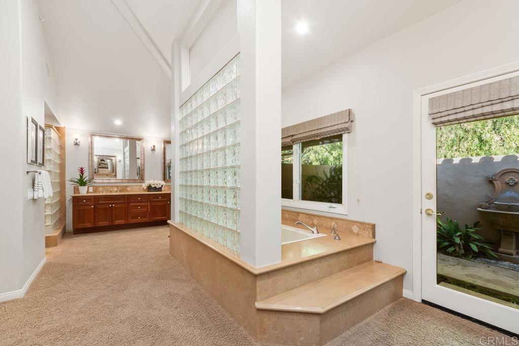 7196 Rancho La Cima Drive Rancho Santa Fe, CA 92067 - Photo 32 of 57 a view of living room filled with furniture and window