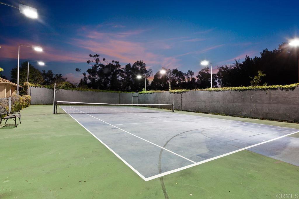 7196 Rancho La Cima Drive Rancho Santa Fe, CA 92067 - Photo 5 of 57 a view of a tennis court