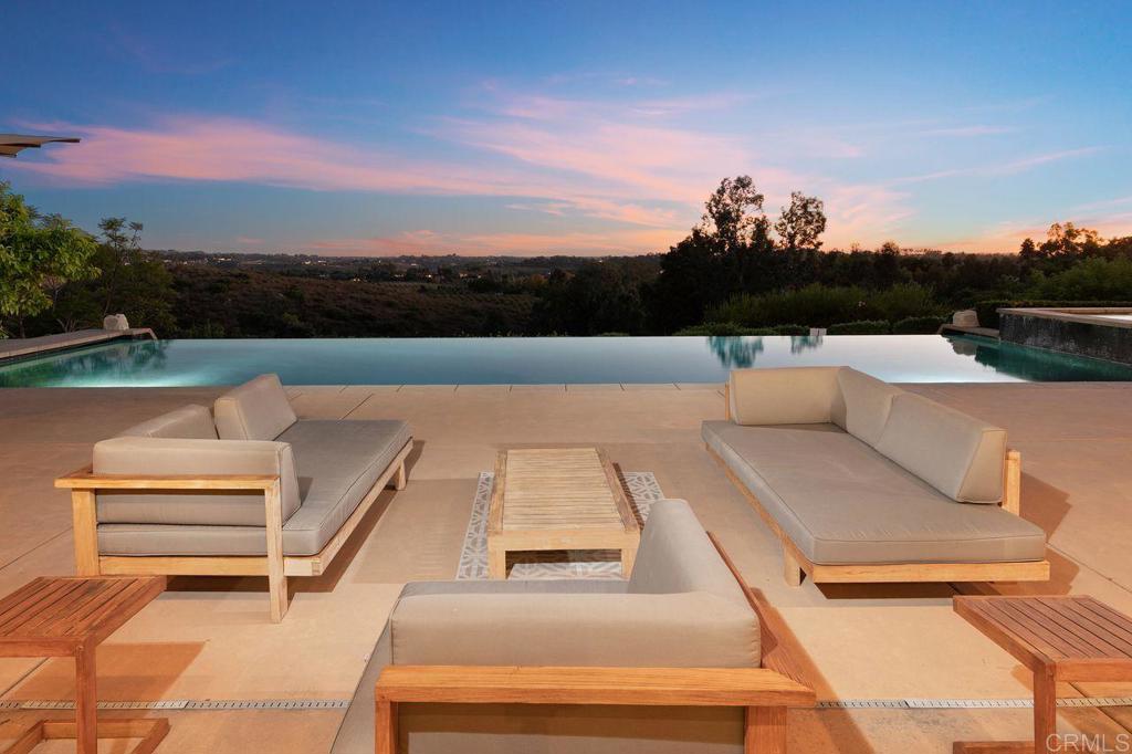 7196 Rancho La Cima Drive Rancho Santa Fe, CA 92067 - Photo 6 of 57 a view of a terrace with couches and sky view