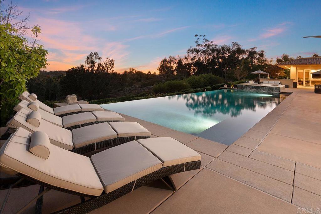 7196 Rancho La Cima Drive Rancho Santa Fe, CA 92067 - Photo 7 of 57 a view of a lake with couches