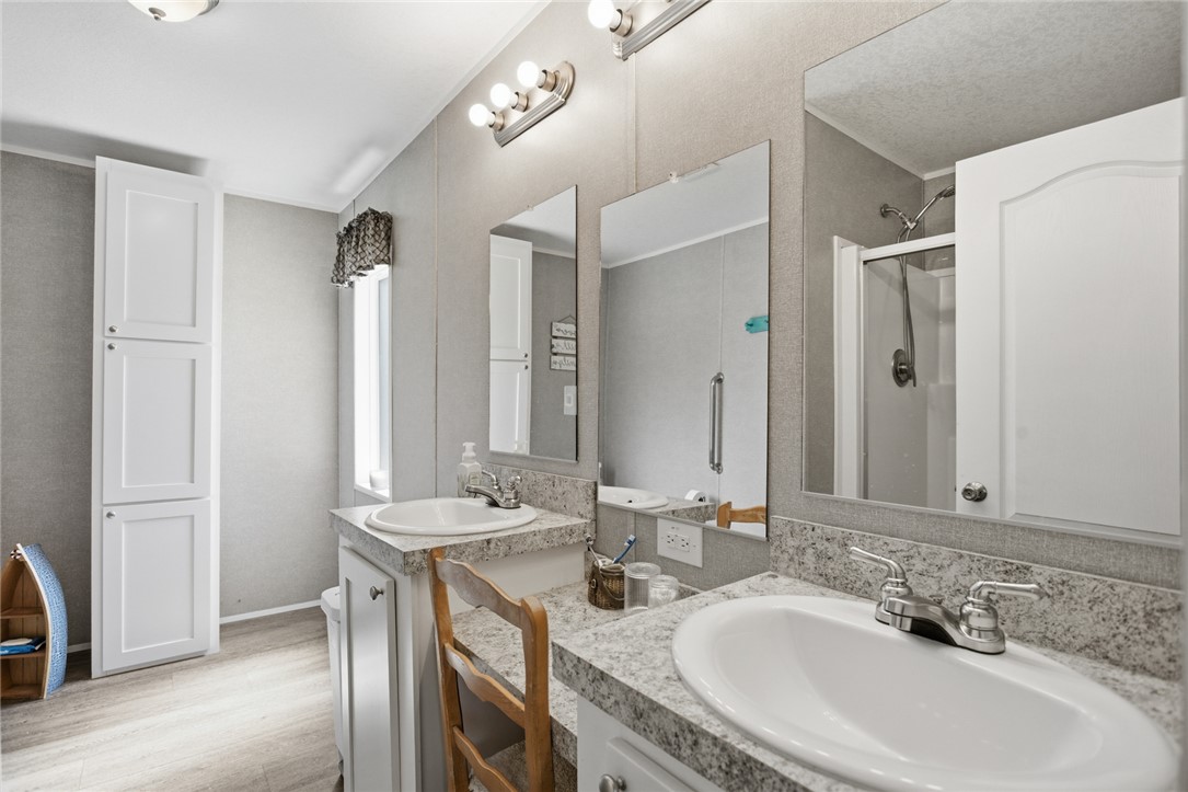 240 Southeast 147 Seneca, SC 29678 - Photo 15 of 26 This bathroom features a double vanity and a shower for ultimate comfort.