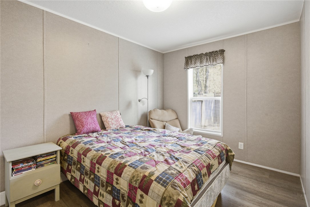 240 Southeast 147 Seneca, SC 29678 - Photo 20 of 26 This cozy bedroom features durable flooring, offering a comfortable retreat for relaxation.