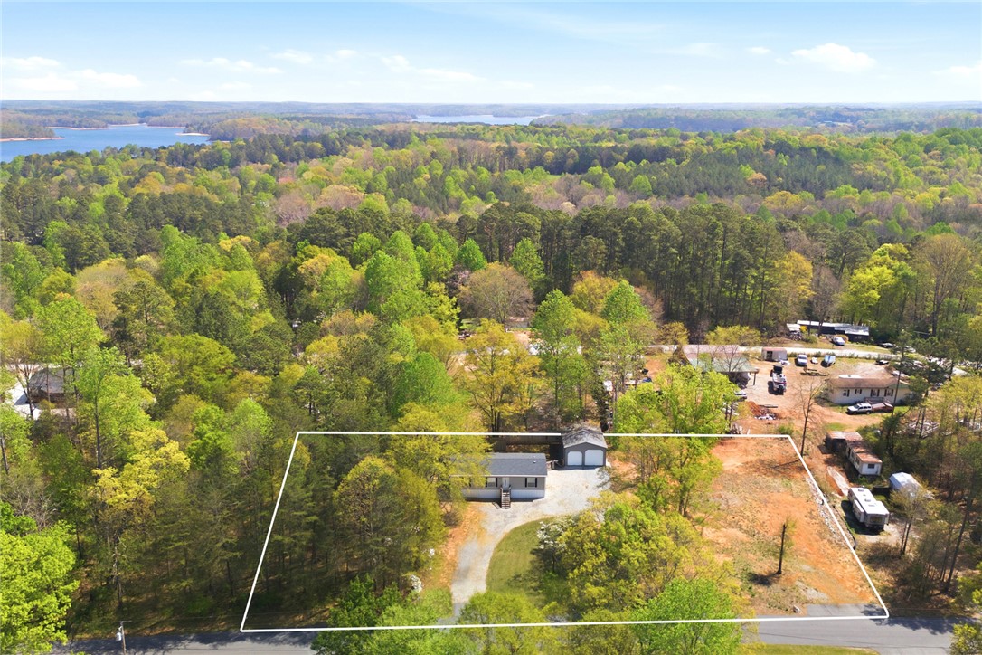 240 Southeast 147 Seneca, SC 29678 - Photo 21 of 26 This tranquil setting offers panoramic views of the surrounding natural beauty and distant lake.