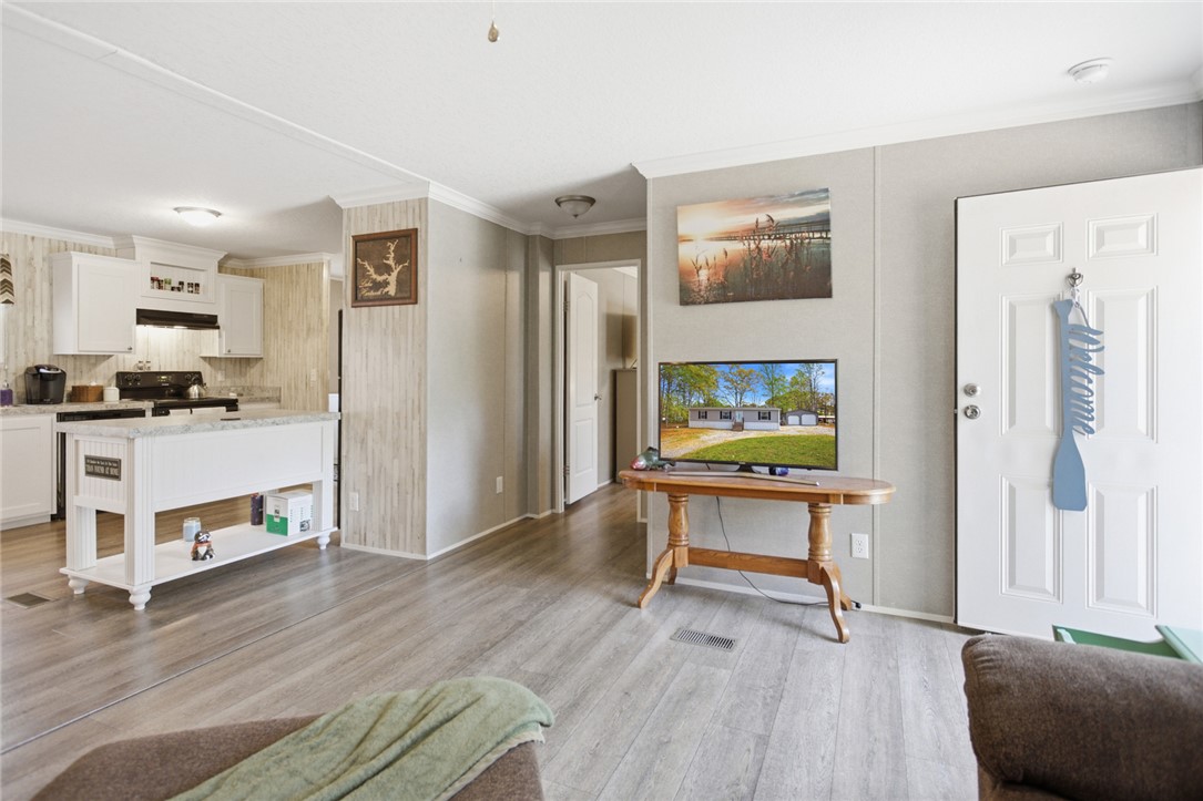 240 Southeast 147 Seneca, SC 29678 - Photo 8 of 26 This inviting space offers a seamless flow between the kitchen and living area, perfect for daily living.