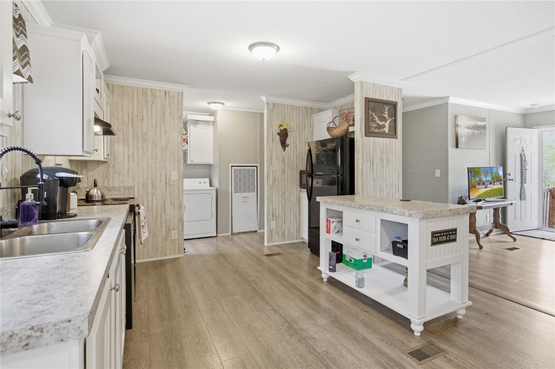 240 Southeast 147 Seneca, SC 29678 - Photo 10 of 26 This spacious kitchen offers a functional island and abundant cabinet space.