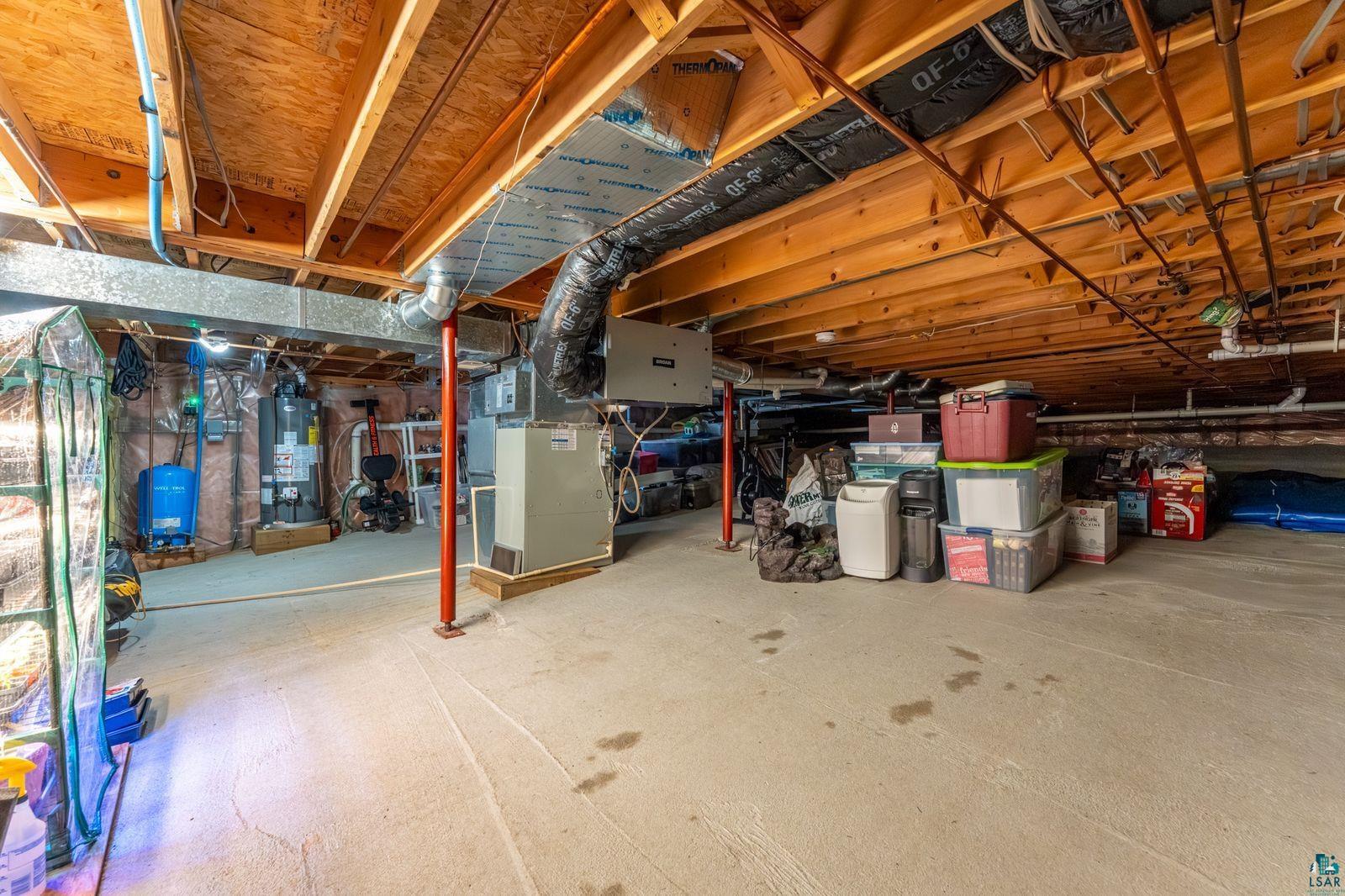 4452 Moccasin Point Road Tower, MN 55790 - Photo 26 of 44 Basement featuring exposed wooden joists, concrete flooring, and visible ductwork