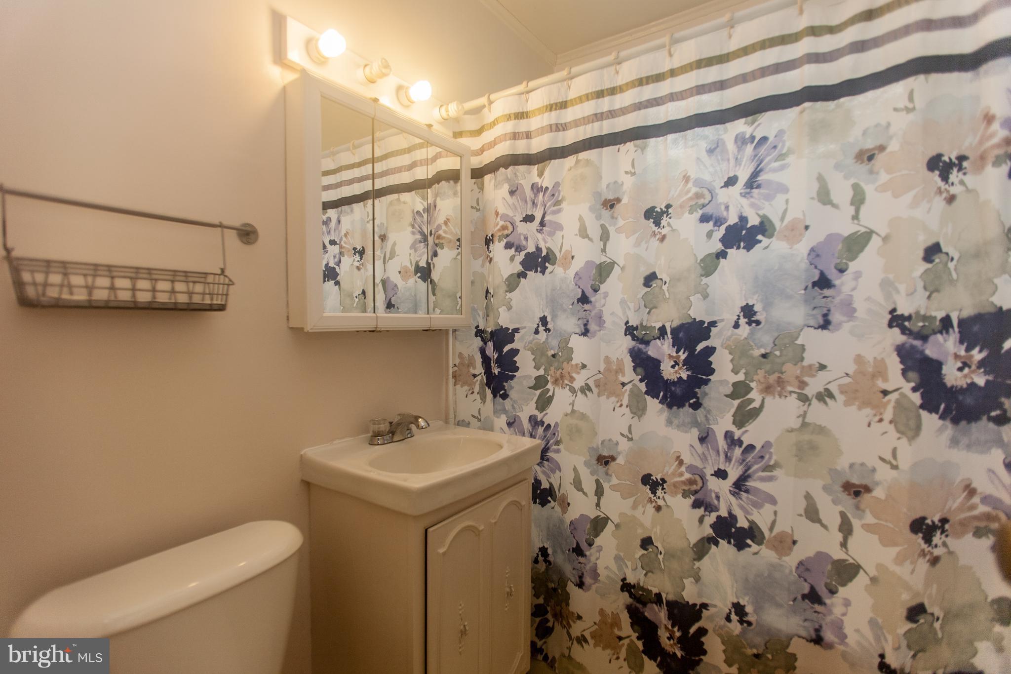 54 Ridge Road, Unit K Greenbelt, MD 20770 - Photo 11 of 29 a bathroom with a toilet and a sink