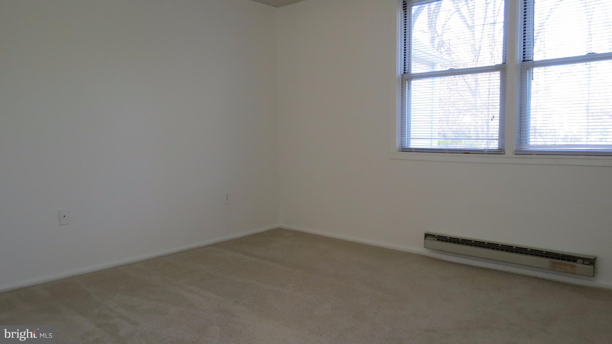 54 Ridge Road, Unit K Greenbelt, MD 20770 - Photo 16 of 29 an empty room with a window