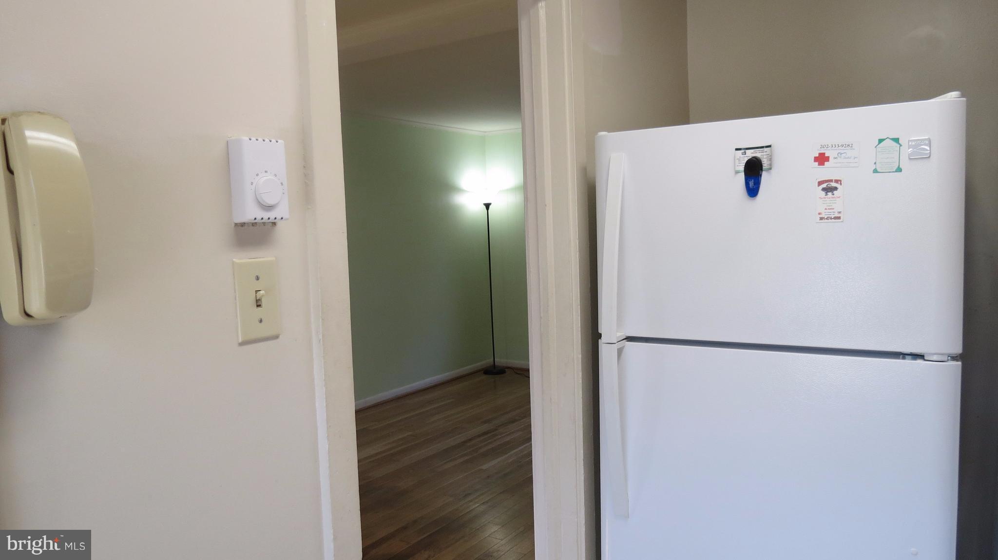 54 Ridge Road, Unit K Greenbelt, MD 20770 - Photo 6 of 29 a white refrigerator freezer sitting inside of a kitchen