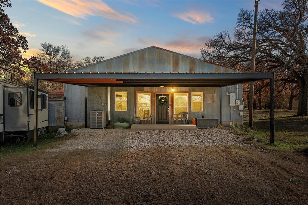 221 Saffle Road Robinson, TX 76706 - Photo 1 of 40 a front view of a house with a garden