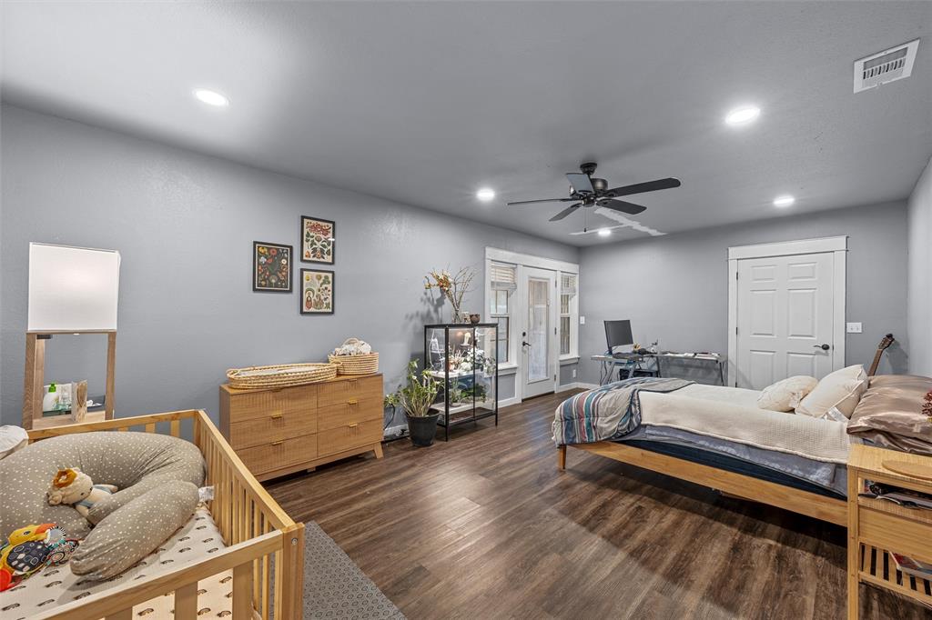 221 Saffle Road Robinson, TX 76706 - Photo 16 of 40 a bedroom with furniture and a wooden floor