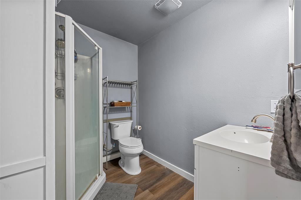 221 Saffle Road Robinson, TX 76706 - Photo 18 of 40 a bathroom with a toilet sink and mirror