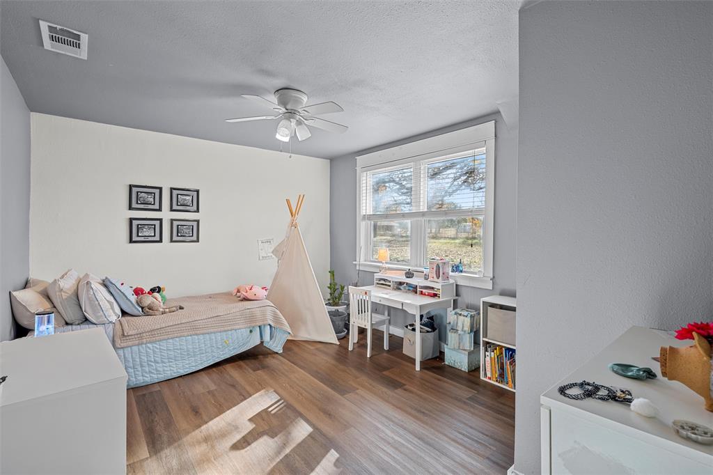 221 Saffle Road Robinson, TX 76706 - Photo 19 of 40 a living room with furniture and wooden floor
