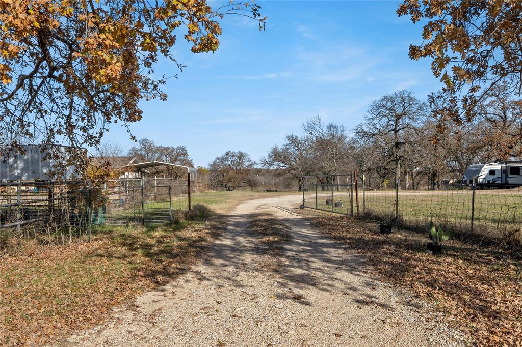 221 Saffle Road Robinson, TX 76706 - Photo 2 of 40 a view of a yard with wooden fence