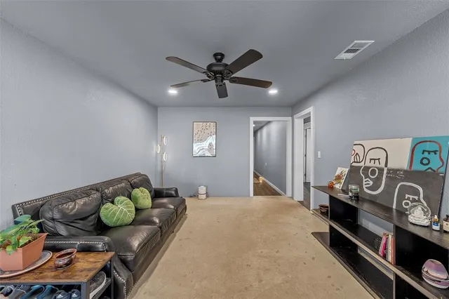 a bedroom with furniture and a chandelier