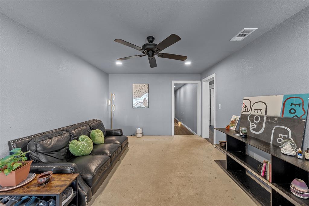 221 Saffle Road Robinson, TX 76706 - Photo 8 of 40 a bedroom with furniture and a chandelier