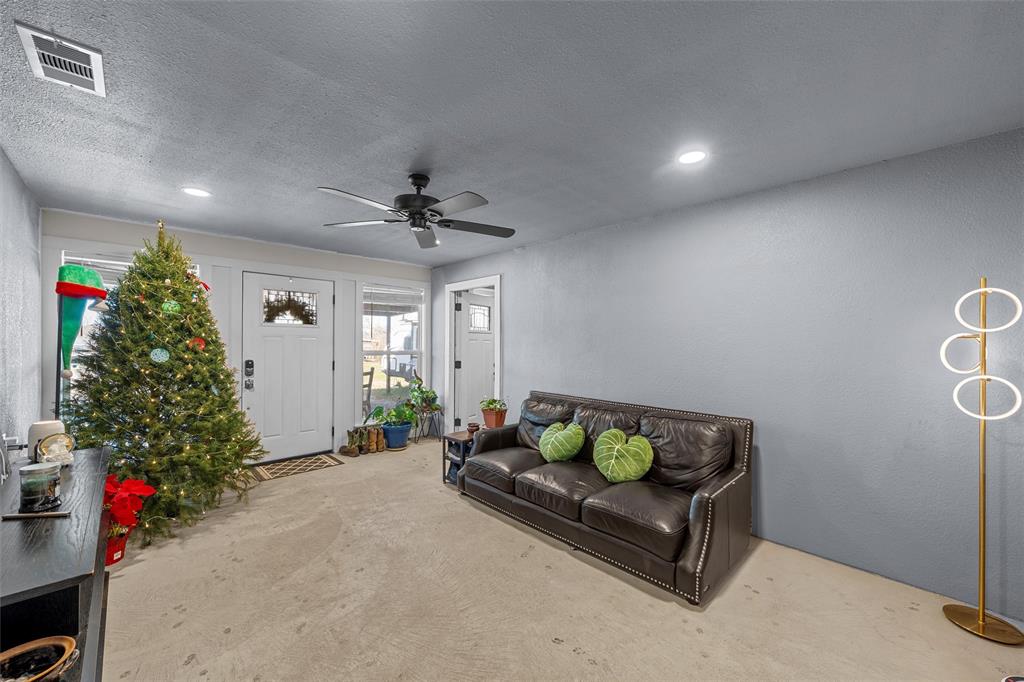 221 Saffle Road Robinson, TX 76706 - Photo 9 of 40 a living room with furniture and a potted plant