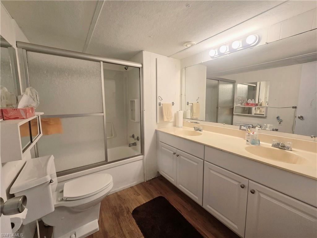 99 Moorhead Manor, Unit 99 Naples, FL 34112 - Photo 16 of 26 a bathroom with a sink a toilet and shower