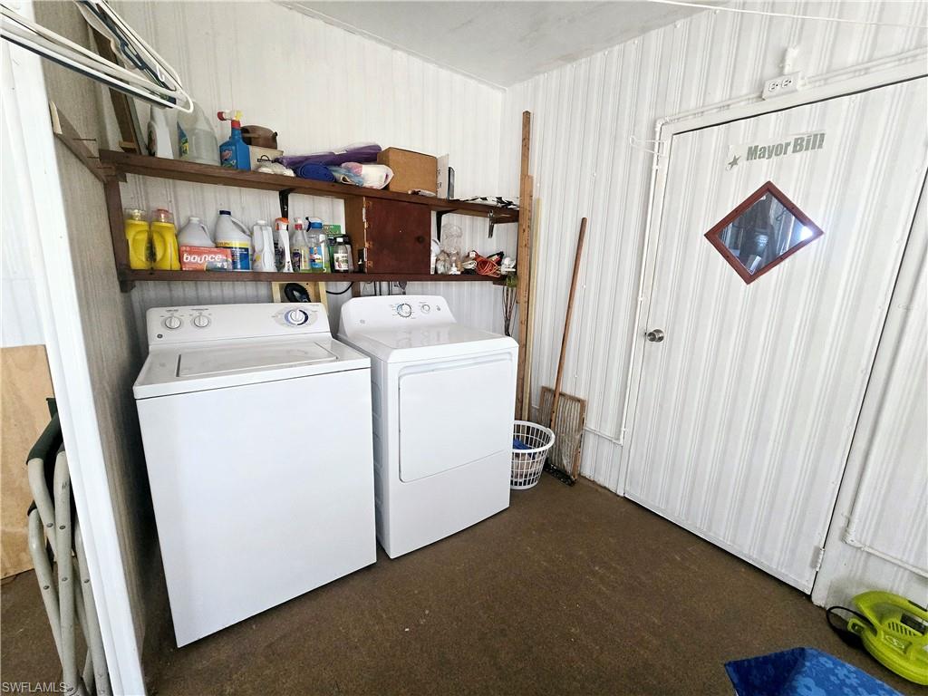 99 Moorhead Manor, Unit 99 Naples, FL 34112 - Photo 20 of 26 a utility room with dryer and washer