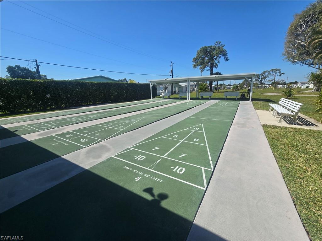 99 Moorhead Manor, Unit 99 Naples, FL 34112 - Photo 25 of 26 a view of a tennis court