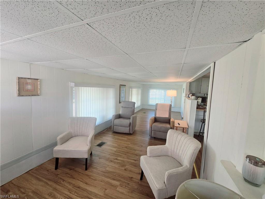 99 Moorhead Manor, Unit 99 Naples, FL 34112 - Photo 3 of 26 a living room with furniture and a couch
