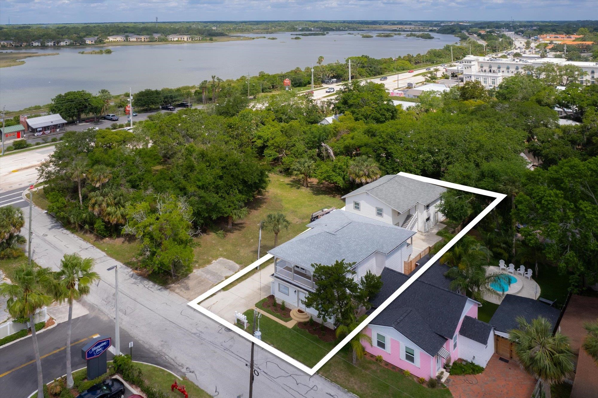 28 Sebastian Avenue, Unit D St. Augustine, FL 32084 - Photo 16 of 23 an aerial view of a house with a lake view