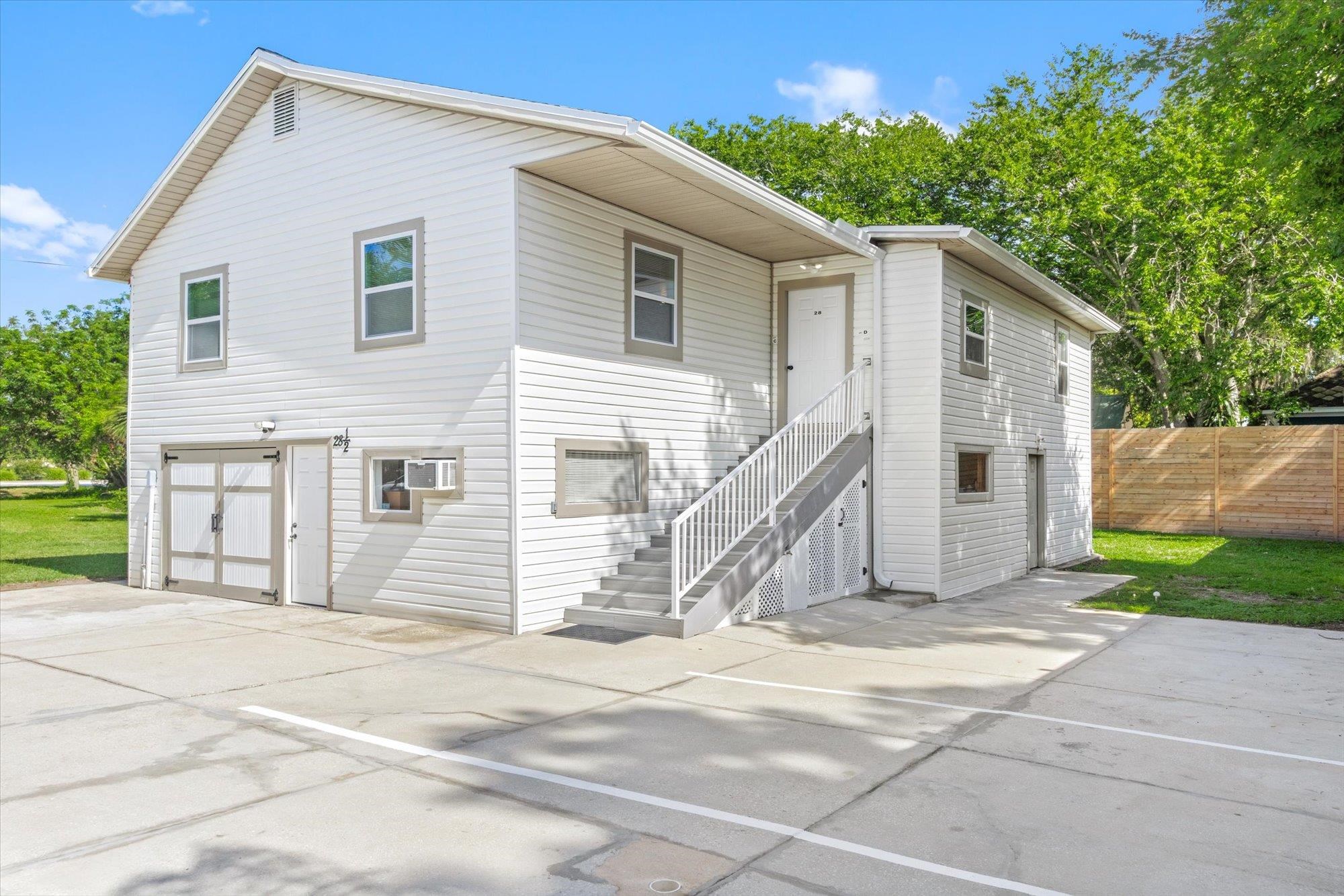 28 Sebastian Avenue, Unit D St. Augustine, FL 32084 - Photo 2 of 23 a view of a house with a backyard