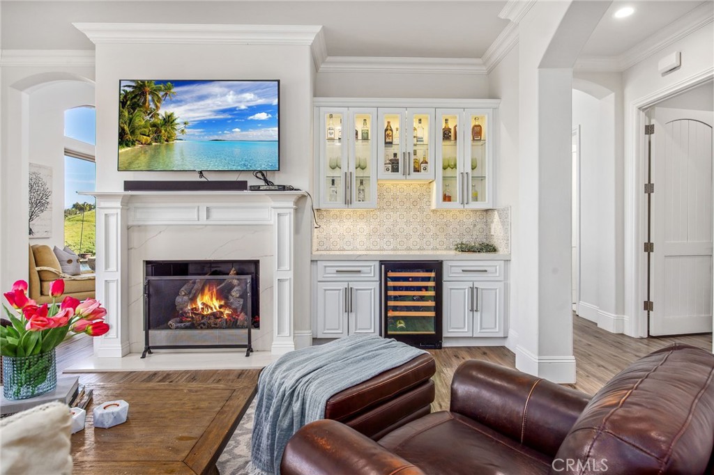 4709 Briana Court Fallbrook, CA 92028 - Photo 13 of 57 a living room with furniture a flat screen tv and a fireplace