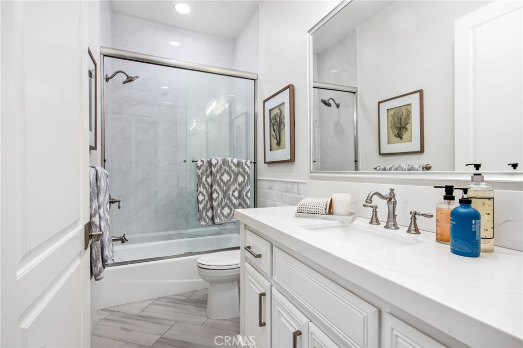 4709 Briana Court Fallbrook, CA 92028 - Photo 22 of 57 a bathroom with a sink a toilet and shower