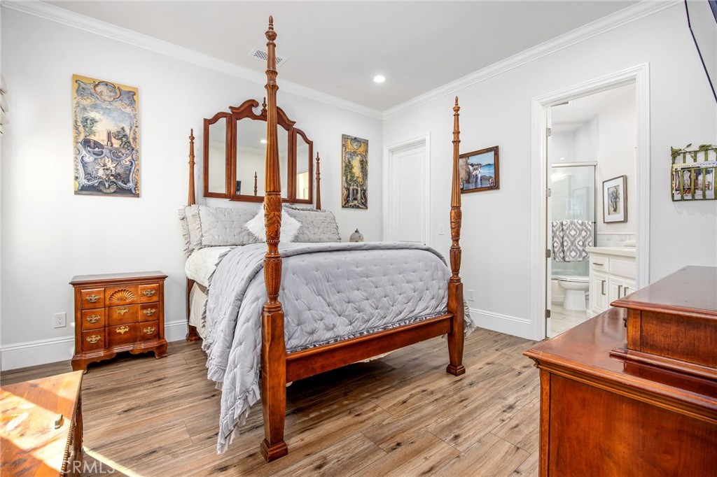 4709 Briana Court Fallbrook, CA 92028 - Photo 23 of 57 a bedroom with a bed and wooden floor