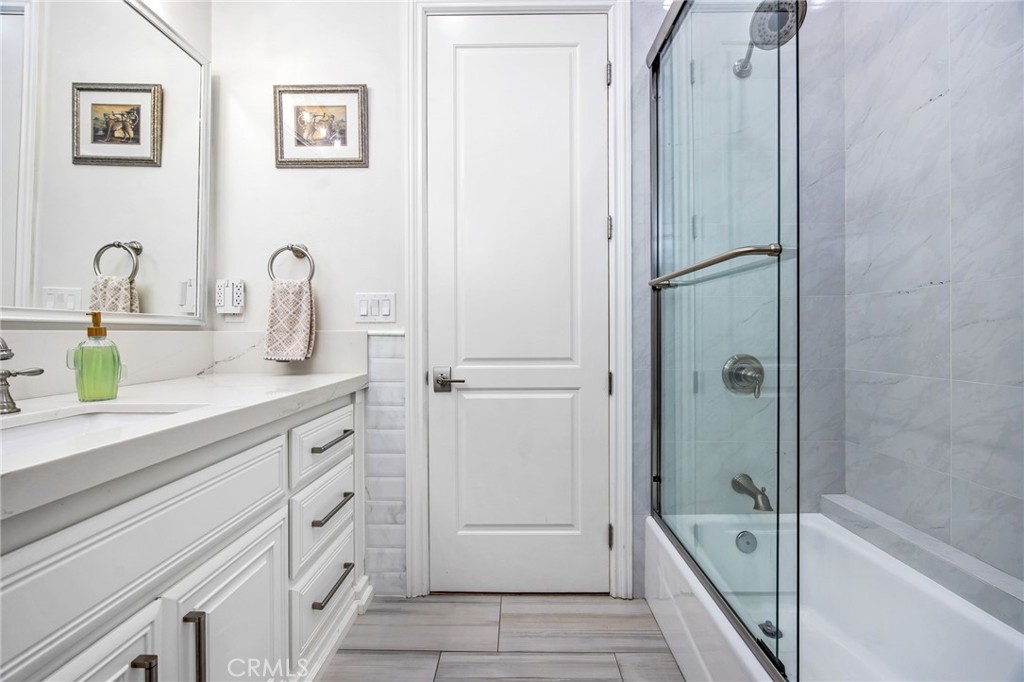 4709 Briana Court Fallbrook, CA 92028 - Photo 37 of 57 a bathroom with a tub shower sink and mirror