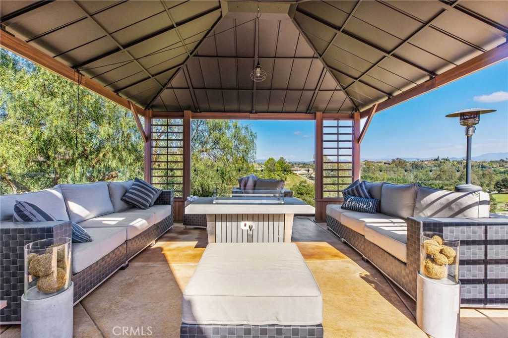 4709 Briana Court Fallbrook, CA 92028 - Photo 41 of 57 a balcony with furniture and a garden view