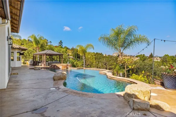 a view of a backyard of the house