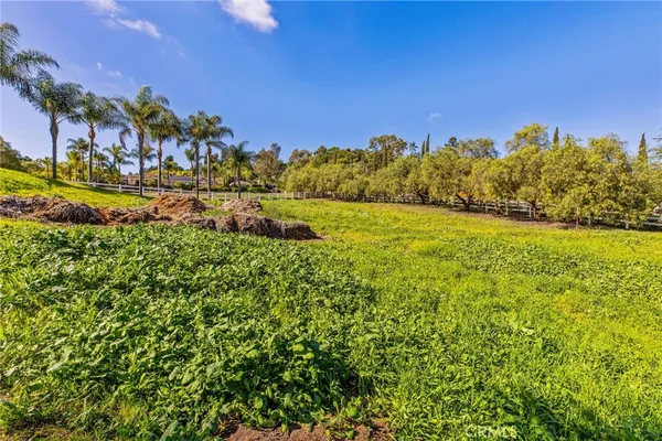 an aerial view of residential houses with outdoor space and swimming pool