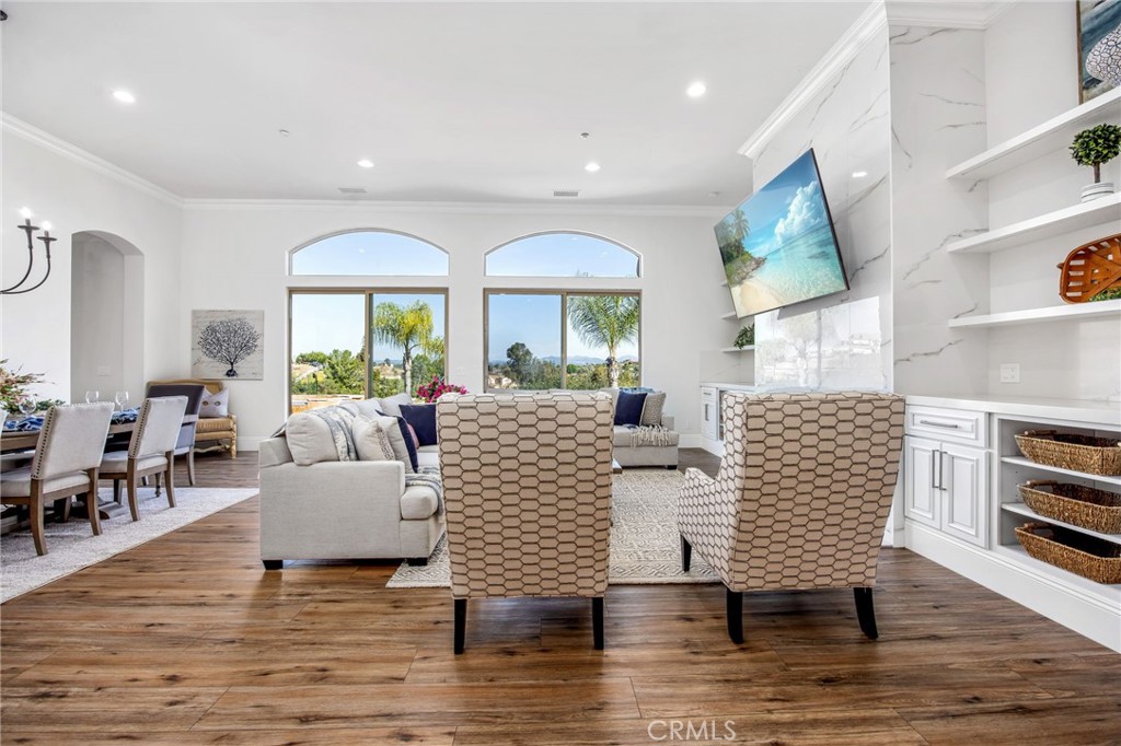 4709 Briana Court Fallbrook, CA 92028 - Photo 6 of 57 a living room with couches and a dining table with wooden floor