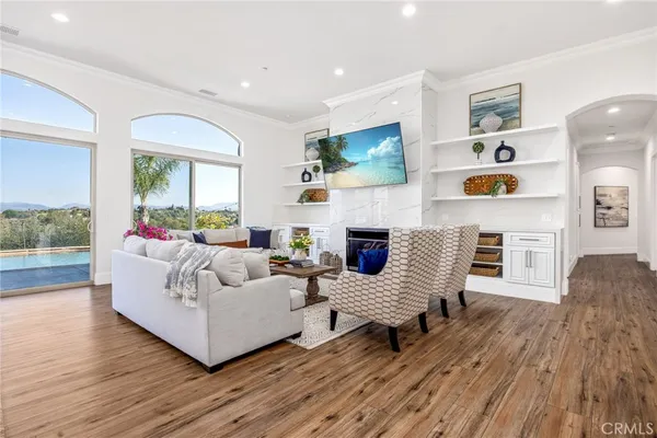 a living room with furniture fireplace and flat screen tv