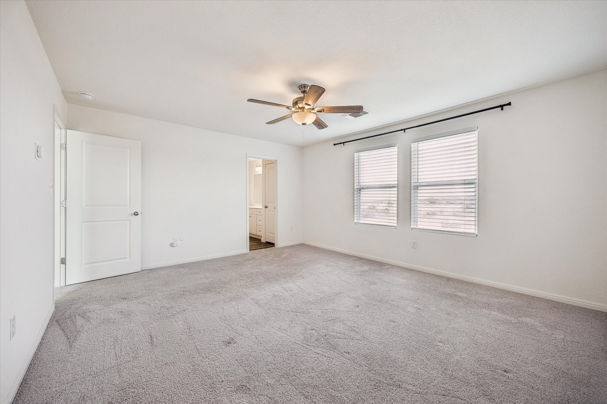 208 Night Riders Way Jarrell, TX 76537 - Photo 13 of 31 an empty room with windows and ceiling fan