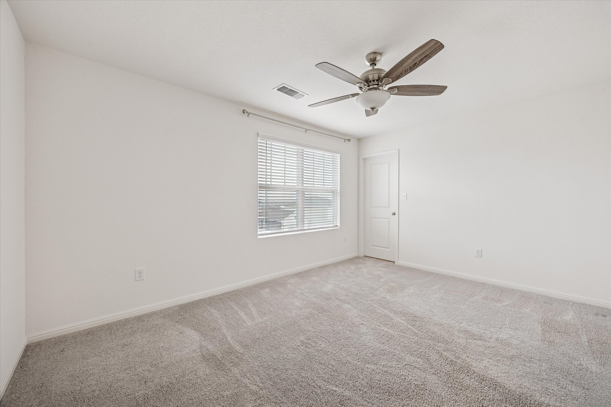 208 Night Riders Way Jarrell, TX 76537 - Photo 20 of 31 a view of an empty room with a window