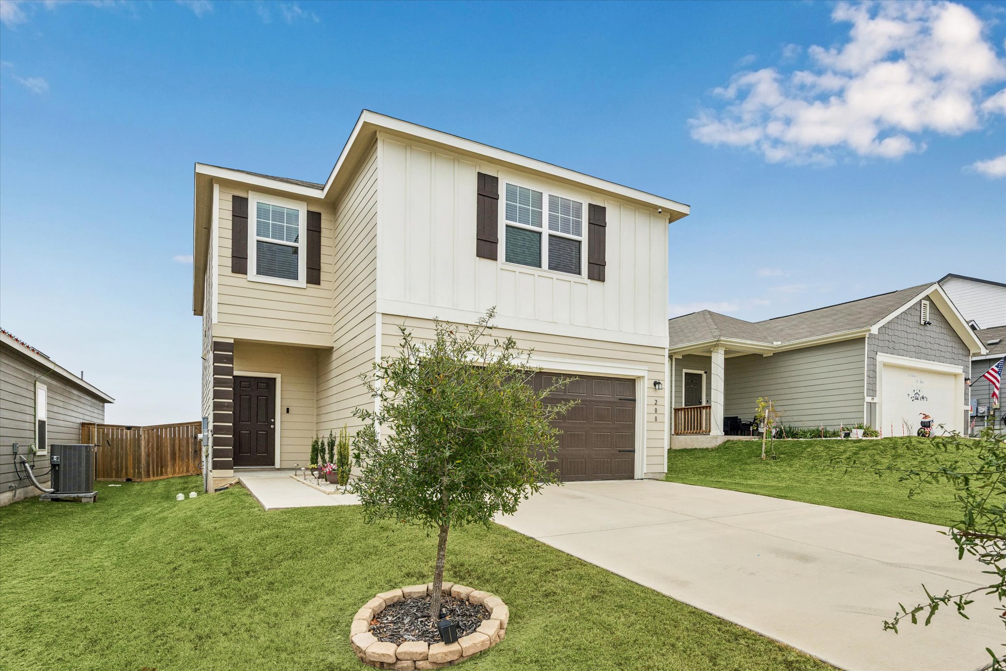 208 Night Riders Way Jarrell, TX 76537 - Photo 25 of 31 a front view of a house with a yard and garage