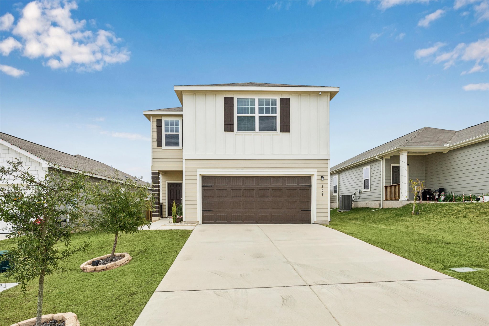 208 Night Riders Way Jarrell, TX 76537 - Photo 26 of 31 a front view of a house with a yard and garage