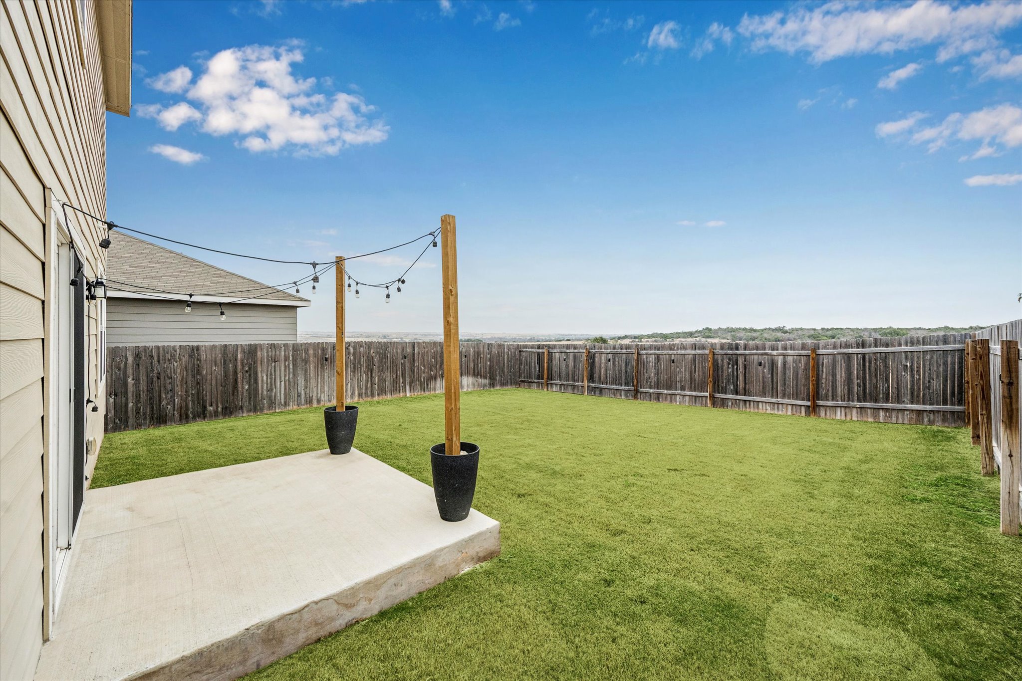 208 Night Riders Way Jarrell, TX 76537 - Photo 28 of 31 a view of a backyard with a slide