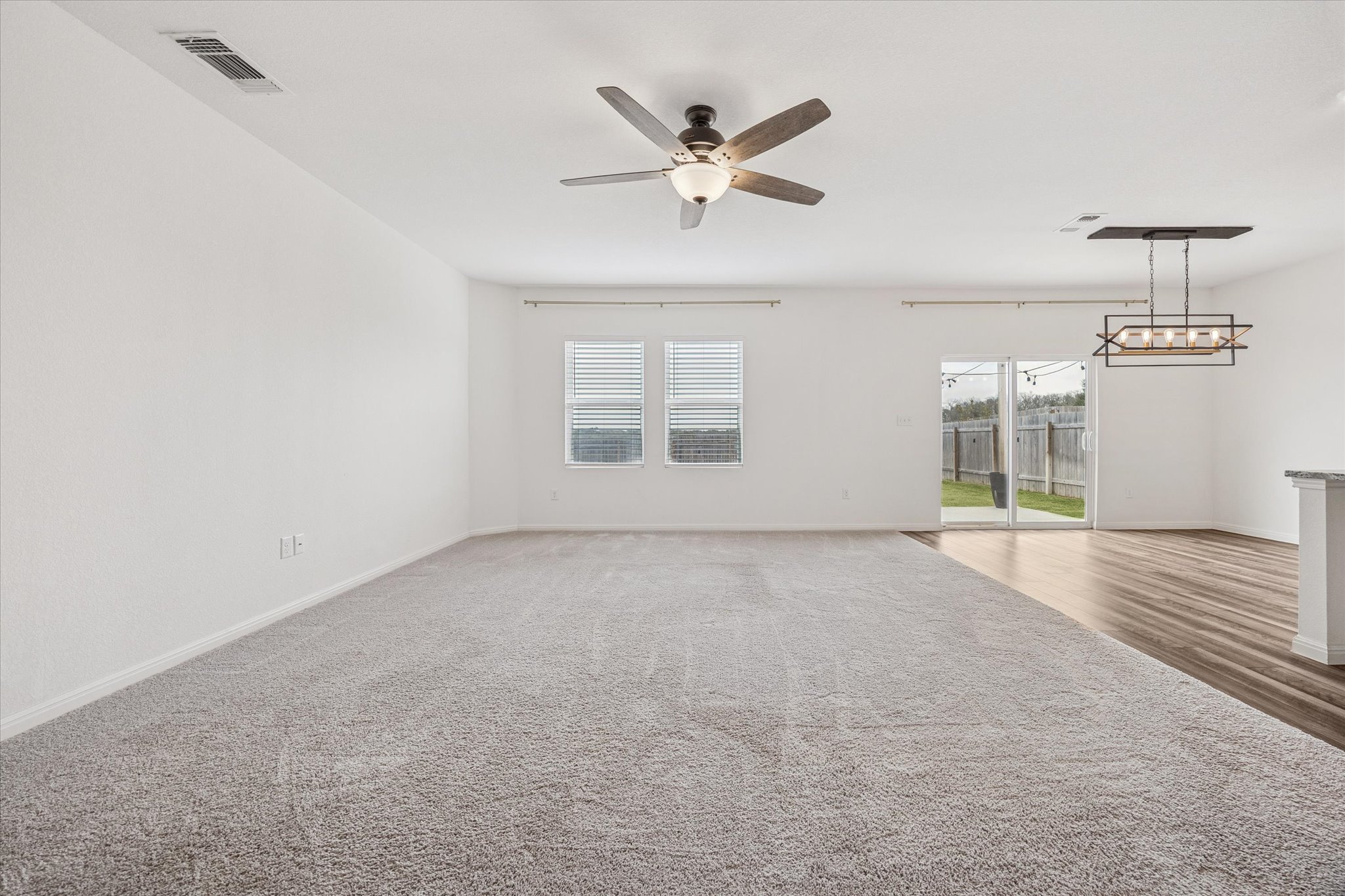 208 Night Riders Way Jarrell, TX 76537 - Photo 6 of 31 an empty room with ceiling fan and window