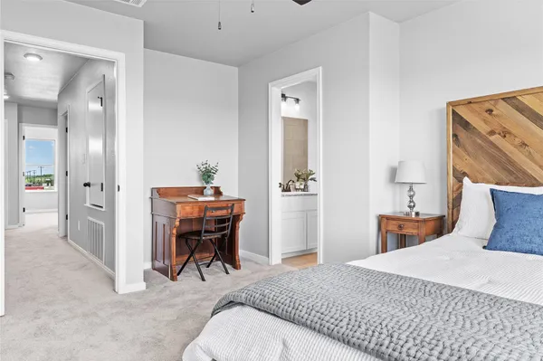 a bedroom with a bed and a table in it