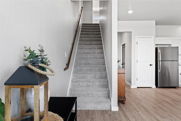 a view of entryway with wooden floor and stairs