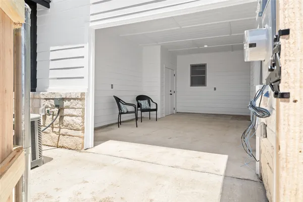 a view of a livingroom with furniture and a window
