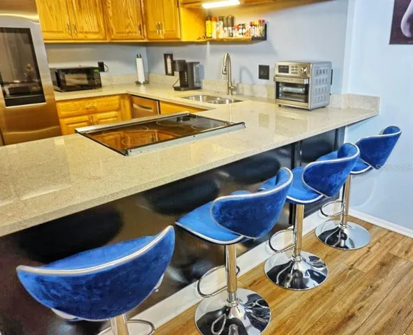 a kitchen with table and chairs