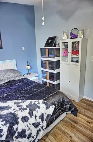 a bedroom with a bed and cabinets