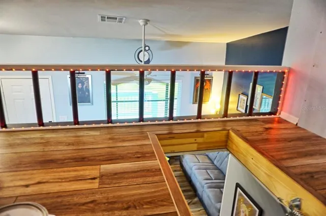 a bathroom with a granite countertop sink and a large window