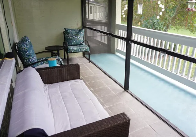 a view of balcony with furniture