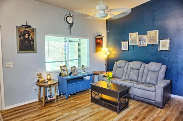 a living room with furniture and window